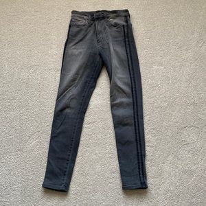 Charcoal gray skinny jeans with black stripes on side